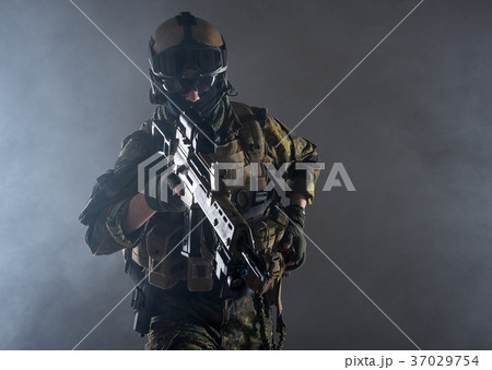 Orderly peacemaker looking at sniper scope Orderly peacemaker looking at sniper scope 37029754