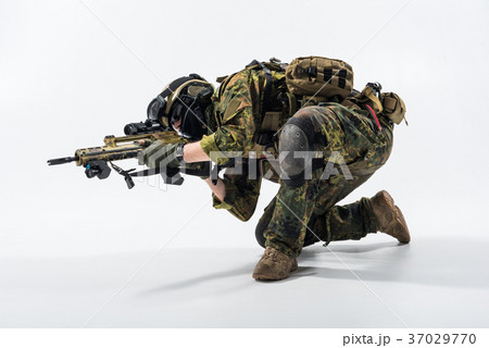 Male defender firing with weapon 37029770