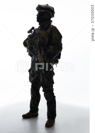 Serious defender keeping modern weapon in arms Serious defender keeping modern weapon in arms 37030005