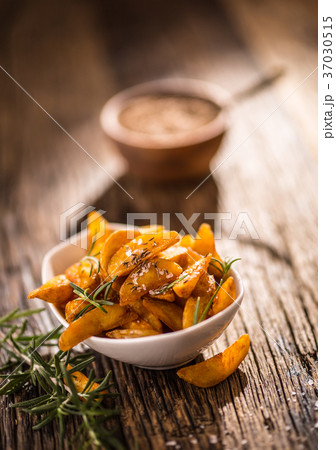 Roasted american potatoes with rosemary and salt.  37030515
