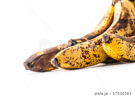 Over ripe bananas isolated on white with shadows. Over ripe bananas isolated on white with shadows. 37030565