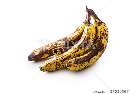 Over ripe bananas isolated on white with shadows. Over ripe bananas isolated on white with shadows. 37030567