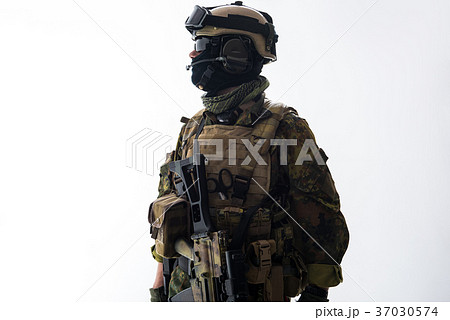 Calm soldier telling by gadget Calm soldier telling by gadget 37030574