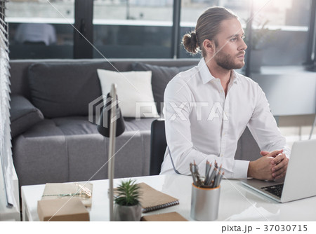 Considerate guy working in the office Considerate guy working in the office 37030715