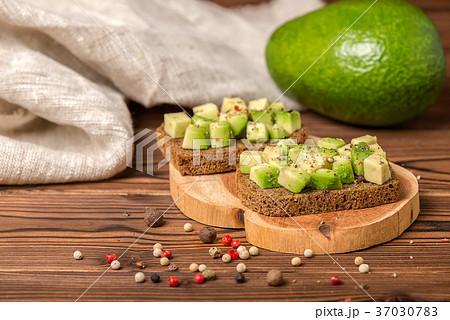 sandwiches with diced avocado, cutted rye bread 37030783