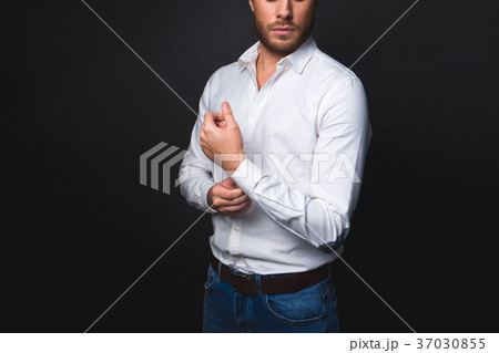 Tranquil male buttoning on cuff Tranquil male buttoning on cuff 37030855