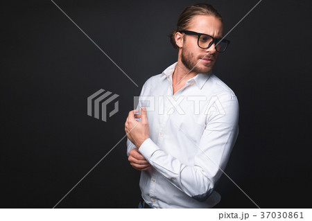 Focused bearded male in glasses 37030861