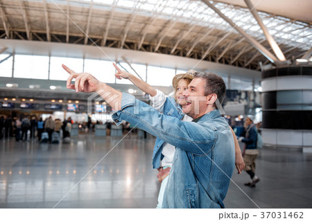 Cheerful middle-aged man is holding child in Cheerful middle-aged man is holding child in 37031462
