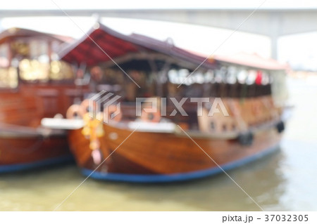 Blurred boat by the river 37032305