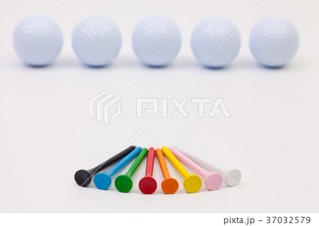White golf balls and different wooden tees 37032579