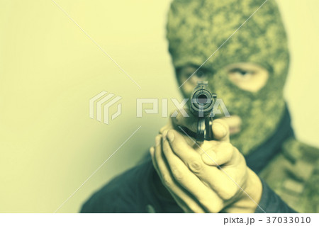 Aiming murderer with a gun Aiming murderer with a gun 37033010