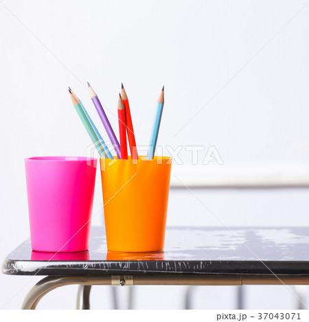 Pencils and book on table Pencils and book on table 37043071