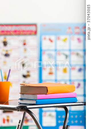 Pencils and book on table 37043085