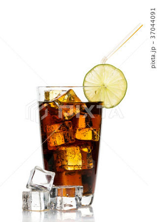 Glass of cola with ice cubes, lime and straw Glass of cola with ice cubes, lime and straw 37044091
