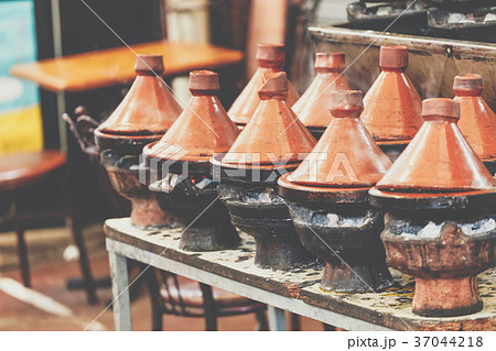 Cooking of meat in traditional Moroccan tajine Cooking of meat in traditional Moroccan tajine 37044218