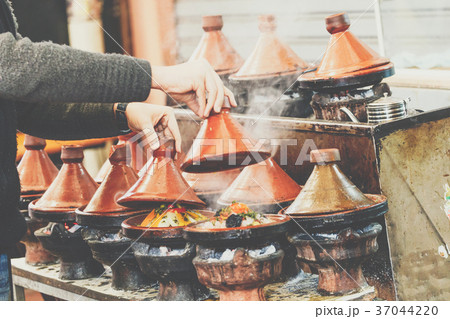 Cooking of meat in traditional Moroccan tajine 37044220