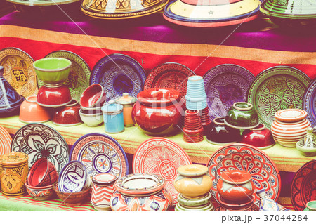 Plates, tajines and pots made of clay on the souk 37044284