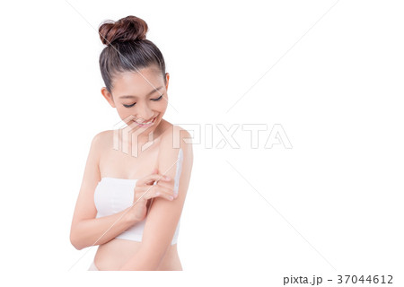 Woman applying lotion on arm over white 37044612