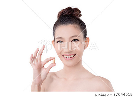 Woman holding vitamin over white background 37044619
