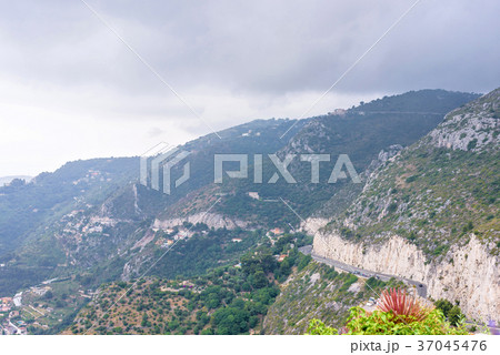 Daylight foggy view to Eze village, trees 37045476
