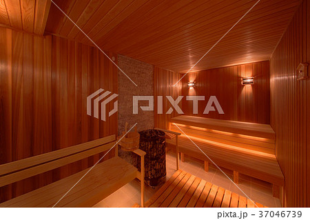 The burning coals in a wooden sauna with wooden be The burning coals in a wooden sauna with wooden be 37046739