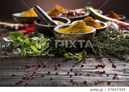 Spices on wooden bowl background Spices on wooden bowl background 37047495