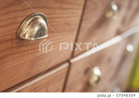 closeup of wooden chest of drawers closeup of wooden chest of drawers 37048304