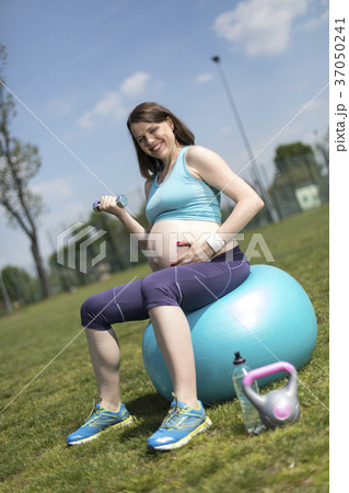 Pregnant woman excercises with gymnastic ball Pregnant woman excercises with gymnastic ball 37050241