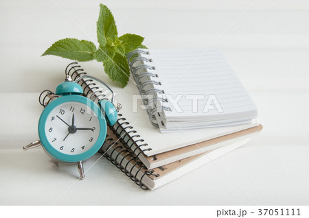 Turquoise alarm clock on white Turquoise alarm clock on white 37051111