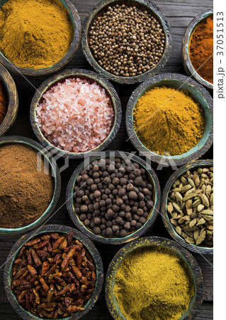 Spices on wooden bowl background Spices on wooden bowl background 37051513