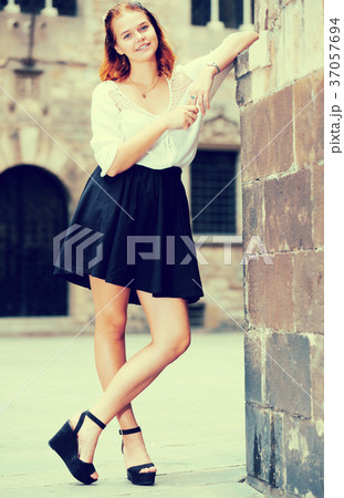 portrait of girl standing near the brick wall portrait of girl standing near the brick wall 37057694