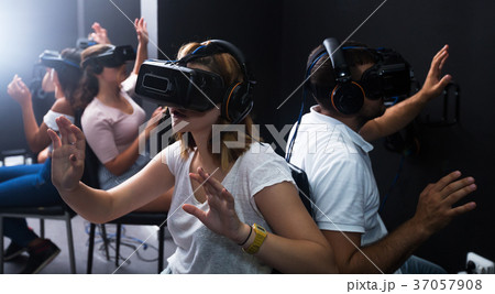 People wearing virtual reality goggles People wearing virtual reality goggles 37057908