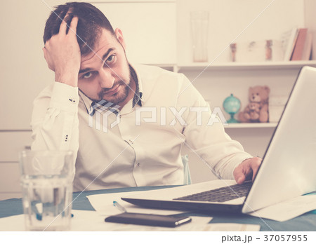 Man having problem in office Man having problem in office 37057955
