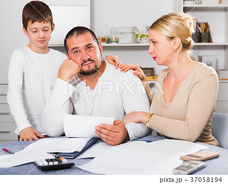 Family soothing chagrined man Family soothing chagrined man 37058194