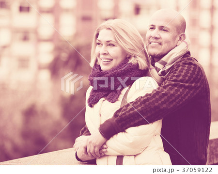 Portrait of positive glad mature couple in city Portrait of positive glad mature couple in city 37059122