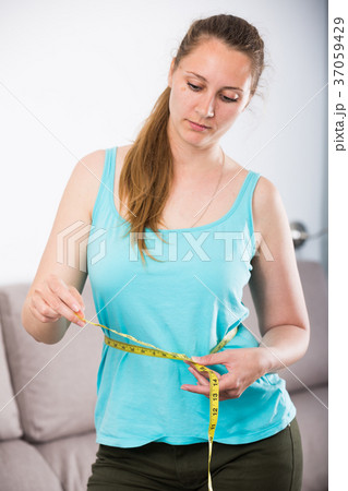 Woman sad to gain weight Woman sad to gain weight 37059429