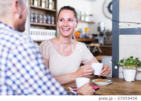 Male and female are having date in cafe Male and female are having date in cafe 37059456