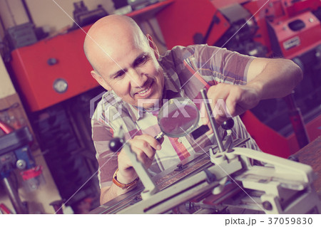 worker making nameboard worker making nameboard 37059830
