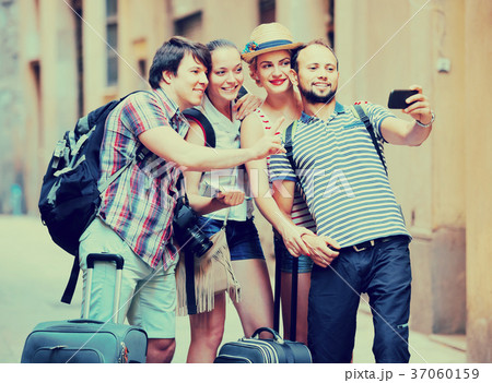 Group of tourists making selfie Group of tourists making selfie 37060159