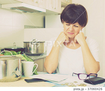 cheerful woman paying bills cheerful woman paying bills 37060426