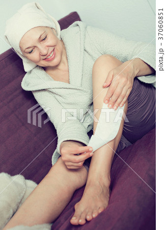 Woman doing body hair removal Woman doing body hair removal 37060851