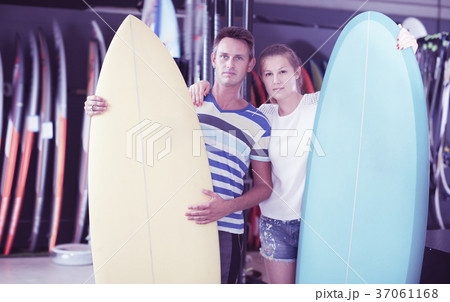 Smiling couple is showing colorful boards 37061168