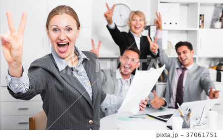 Happy business group with woman at office 37061751