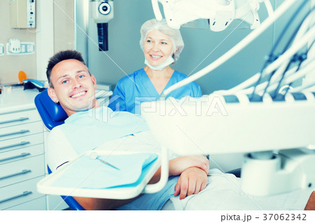 Man in dental chair waiting for examination 37062342