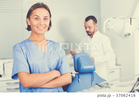 doctor with assistant are posing on workplace in hospital 37062418