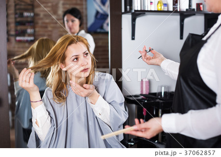 Unhappy woman in hairdress salon 37062857