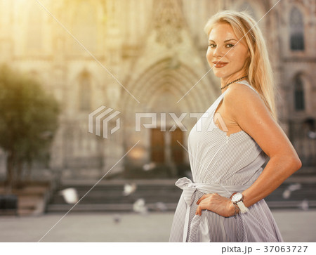 Adult female in the dress at the street Adult female in the dress at the street 37063727