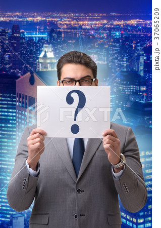 Businessman in uncertainty concept with question 37065209