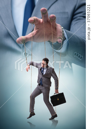 Businessman puppet being manipulated by boss 37065221