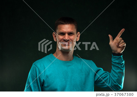 Portrait of positive man in blue sweatshirt 37067380